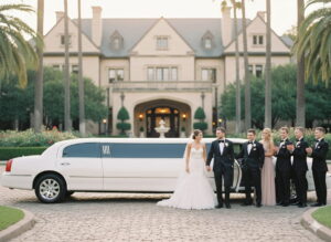 Bride and groom arriving in a luxury wedding limousine in Houston